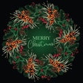 Christmas wreath of tree branches, cones, sea buckthorn and red berries with the inscription Merry Christmas