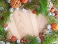 Christmas wreath on wooden background in a frame Royalty Free Stock Photo