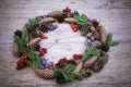 Christmas wreath on the wooden background