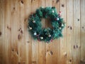 Christmas wreath on wooden wall