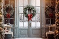 Christmas wreaths on the front blue doors of the house