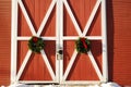 Christmas wreaths on a New England barn