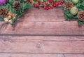 Christmas wreaths and red berries on a wooden table top. copy sace