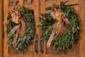 Christmas wreaths on wooden doors Royalty Free Stock Photo
