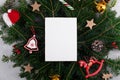 Christmas 5x7 card mockup template with Christmas decoration on natural fir twigs background Royalty Free Stock Photo