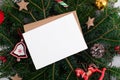 Christmas 5x7 card mockup template with envelop on natural fir branch background Royalty Free Stock Photo