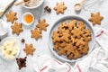 Christmas, X-mas or New Year baking culinary background, cooking recipe. Xmas gingerbread on kitchen table and ingredients Royalty Free Stock Photo