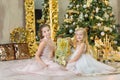 Christmas xmas casual gold studio decorations with cute girl and huge mirror with golden frame plenty presents and big green pine