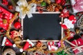 Christmas Xmas New Year holiday background with empty black chalkboard for your text and various festive decorations. blank chalk Royalty Free Stock Photo