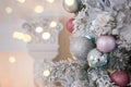 Christmas, xmas, New Year pink and turquoise fur-tree decoration with balls and bowknots, ribbons, flowers on pink lights Royalty Free Stock Photo