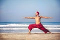 Christmas yoga on the beach Royalty Free Stock Photo