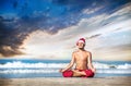 Christmas yoga on the beach Royalty Free Stock Photo