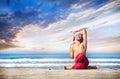 Christmas yoga on the beach Royalty Free Stock Photo