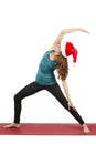 Christmas yoga woman doing reversed warrior pose Royalty Free Stock Photo