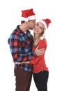 Christmas young beautiful couple in Santa hats in love smiling happy together hugging each other sweet Royalty Free Stock Photo
