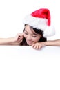 Christmas young girl showing blank billboard