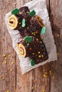 Christmas Yule Log, Buche de Noel, chocolate cake closeup. verti Royalty Free Stock Photo