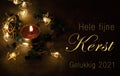 Christmascard in Dutch with candle and lights