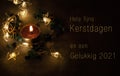 Christmascard in Dutch with candle and lights