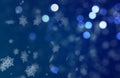 Christmass mood snowflakes falling on a blue Bokeh background