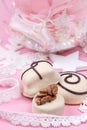 Christmass New Year decorations. Greeting card. White chocolate candy, Christmass ball with pointe shoe. Tender pink color