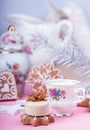 Christmass New Year decorations. Greeting card. White chocolate candy, gingerbread cookies, cup of coffe. Tender pink color. Royalty Free Stock Photo