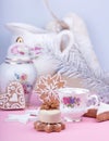 Christmass New Year decorations. Greeting card. White chocolate candy, gingerbread cookies, cup of coffe. Tender pink color. Royalty Free Stock Photo