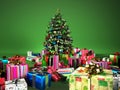 Christmass tree with several gifts, at the green background. Royalty Free Stock Photo