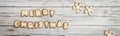 Christmassy grey wood background with gingerbread and Merry Christma`s letter