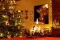 Christmassy illuminated Room Section with Advent Candles Table Decoration and decorated Chirstmas Tree