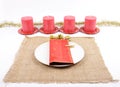 Christmassy table setting with burlap and candles