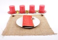 Christmassy table setting with burlap and candles