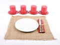 Christmassy table setting with burlap and candles