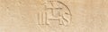 Christogram IHS monogram symbolizing Jesus Christ on stone wall