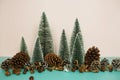 Christmas and happy new year holidays background with Christmas trees and pine cone on pink and blue background Royalty Free Stock Photo