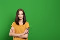 Chroma key compositing. Beautiful woman against green screen