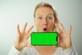 Chroma Key Phone green screen space for advertising Hurray Victory has found Fabulous Photo of a woman in a white T