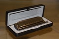 Chromatic harmonica in box Royalty Free Stock Photo