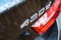 Rear view of a new germ-made sports coupe seen after a rain shower.