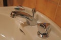 Chrome bathroom faucet. Bathroom water tap. Old faucet. Bathroom interior. Out of focus Royalty Free Stock Photo