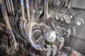 Chrome colored spoons and other different kinds of kitchenware