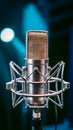 Chrome condenser microphone close up on stage, professional audio equipment