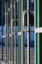 Chrome door handle and glass of modern aluminium office facade