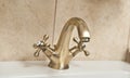 Chrome dripping tap. Sink faucet in bathroom. Water saving concept. Closeup of water-supply faucet mixer for water Royalty Free Stock Photo