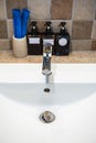 Chrome faucet washbasin. Interior of bathroom with sink basin faucet.