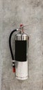 Chrome fire extinguisher hanging on pole Royalty Free Stock Photo