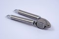 Chrome garlic press. Royalty Free Stock Photo