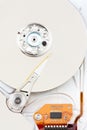 Chrome hard drive with orange ribbon Royalty Free Stock Photo