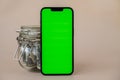 Chrome key smartphone screen mock up template in vertical position on beige background. Copy space App website