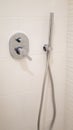 chrome large square shower head, rain funnel in the bathroom, modern design of a chrome wall-mounted shower faucet